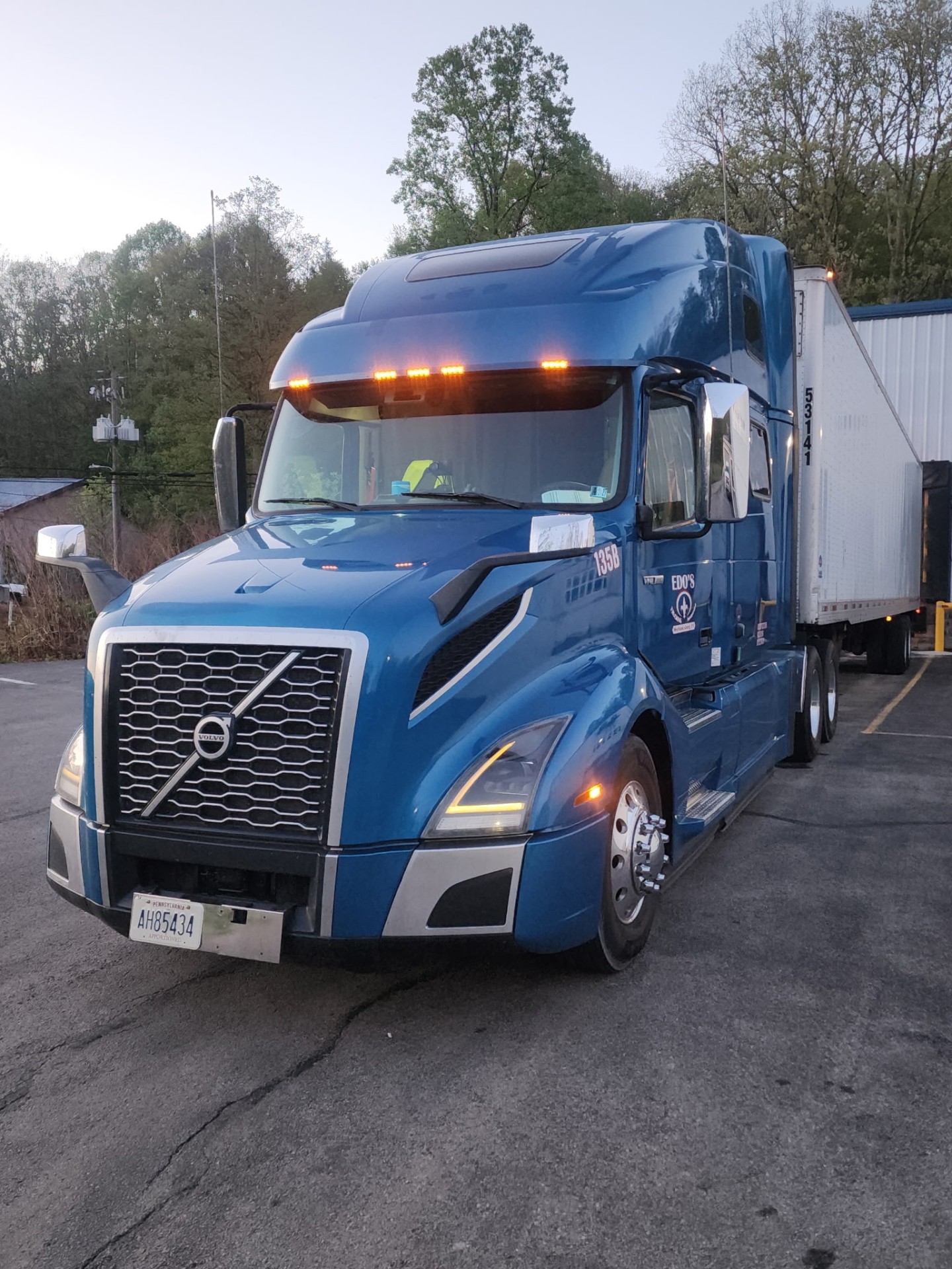 Blue Volvo tractor with trailer