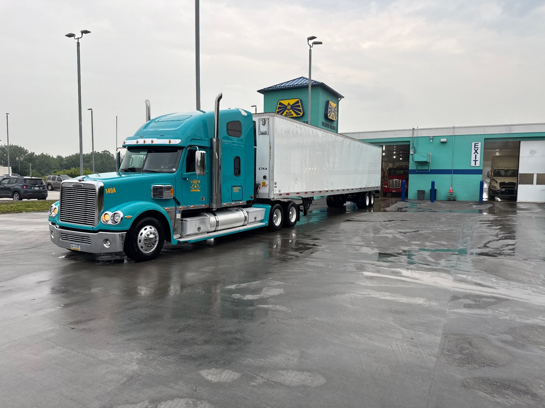 Teal Freightliner at the wash bay